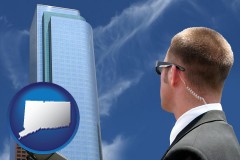 connecticut map icon and security agent watching a downtown area