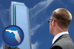 florida map icon and security agent watching a downtown area
