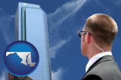 maryland map icon and security agent watching a downtown area