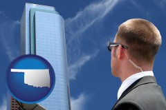 oklahoma map icon and security agent watching a downtown area